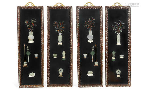 Late Qing Dynasty A set of four bone, ivory, jade and hardstone inset lacquered panels