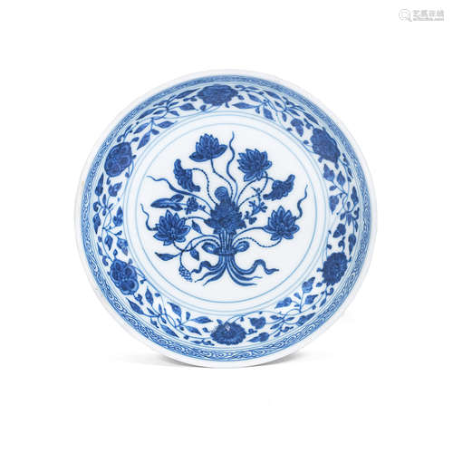 Qianlong seal mark and possibly of the period A small Ming-style blue and white 'lotus bouquet' saucer dish