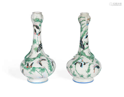 Late Qing Dynasty  A pair of enamelled stoneware garlic-head 'chilong' bottle vases