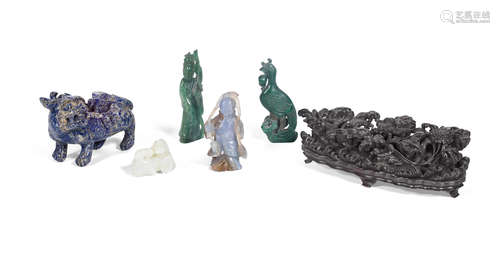 The stand: 18th century, the group of carvings: 19th century and later A carved zitan stand and a group of hardstone and jade carvings