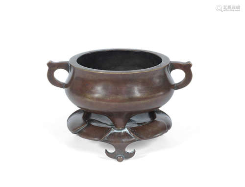 Xuande six-character mark, 17th/18th century A bronze tripod incense burner and stand