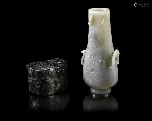 Qing Dynasty, 18th/19th century A mottled green 'clouds and bats' bottle vase and a grey and black jade peach-form box and cover