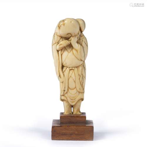 Carved netsuke Japanese, Meiji the standing figure holding a gourd over his left shoulder, mounted