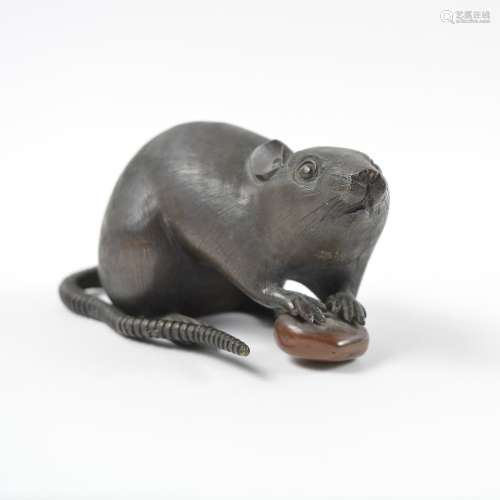 Bronze model of a small rat Japanese, late Meiji 1880-1900 the rat with paws resting upon a chestnut