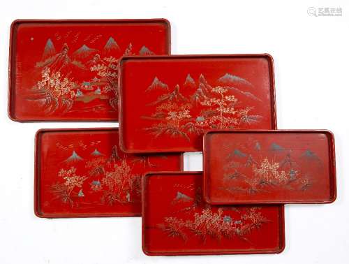 Set of five graduated lacquer trays Chinese of red ground of mountain landscape designs largest 38cm