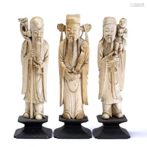 Set of three symbolic figures Chinese, 1880-1900 Shouxing holding peach and staff, Fuxing holding