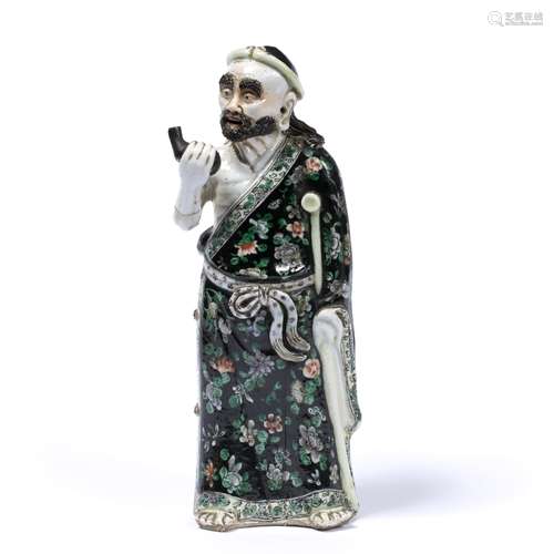 Porcelain figure of an Immortal Chinese, 19th Century decorated in famille verte 29cm high