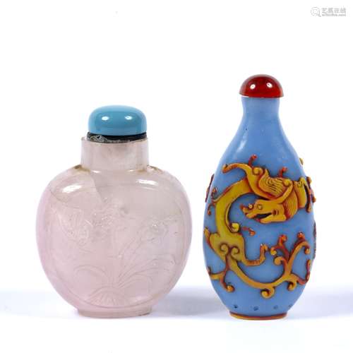 Two carved glass snuff bottles Chinese one in ground blue with two dragons in flight (2)