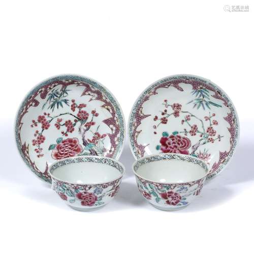 Pair of famille rose tea bowls and saucers Chinese, 18th Century each with blossom decoration