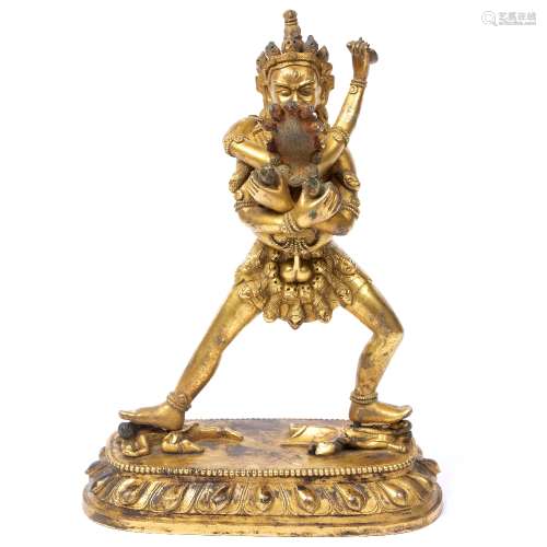 Gilt bronze figure Chinese depicting two mythical figures in embrace, the largest wearing a skirt of