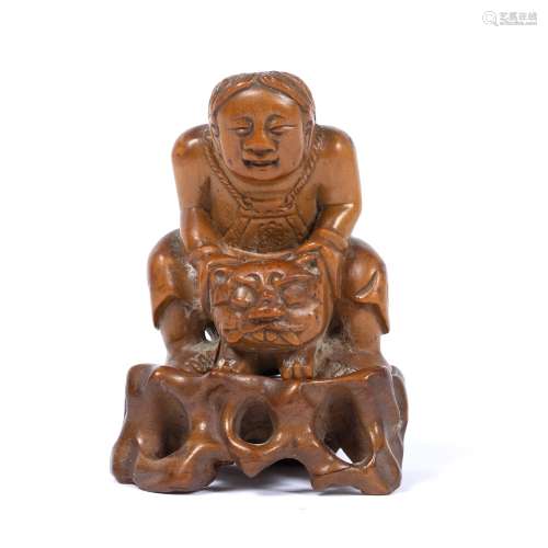 Carved bamboo figure Chinese carved with a crouching boy holding a mask 6.5cm high