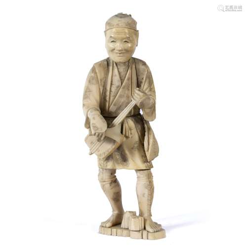 Carved ivory figure of a lute player Japanese, Meiji the standing figure playing the instrument with