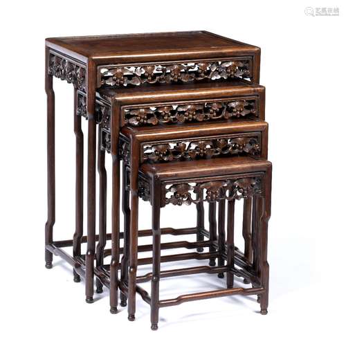 Quartetto of hardwood tables Chinese, circa 1900 each with carved leaf and fruit frieze largest 38.5