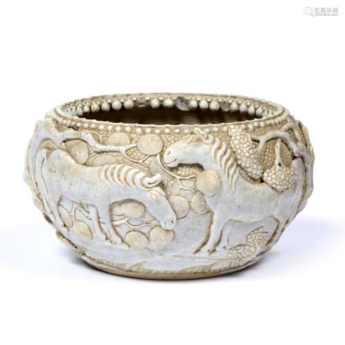 Blanc de chine bowl Chinese, circa 1900 the heavily potted bowl decorated in relief with horses