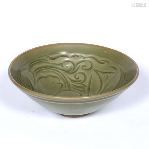 Celadon bowl Chinese decorated to the centre with scrolling leaves, raised on a small foot 20cm