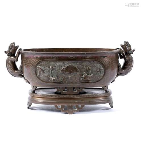 Oval bronze jardiniere Chinese, 19th Century with stylised handles, oval panels of carp and lotus