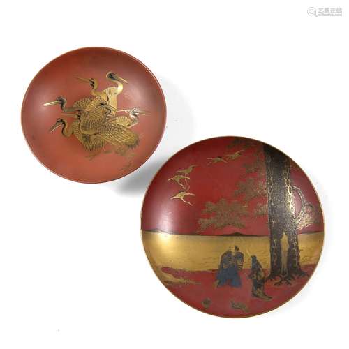 Two red lacquer sake cups Meiji period one decorated with six cranes in gold hiramakiye and