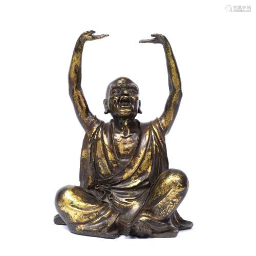 Gilded bronze Lohan Chinese, 19th Century the seated figure with arms raised 21.5cm high