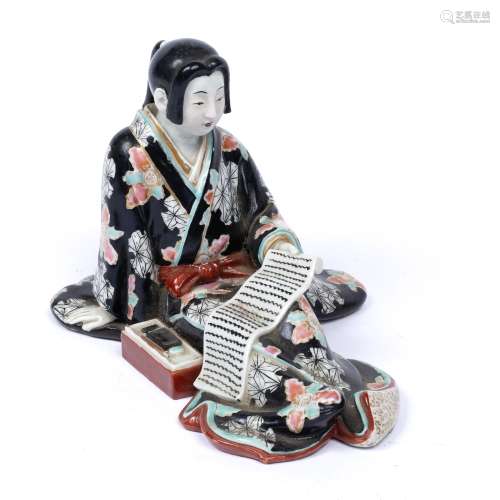 Satsuma model of a geisha Japanese, Meiji the seated girl holding open a scroll with writing box