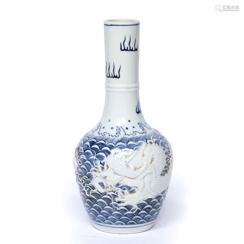 Blue and white bottle vase Chinese, with raised dragon and flaming pearl on a blue wave ground, seal