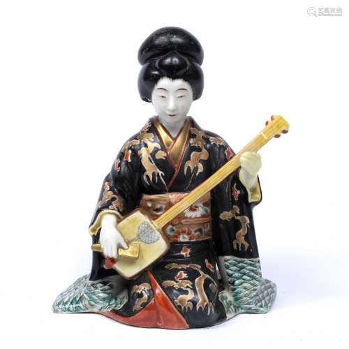 Satsuma model of a kneeling geisha Japanese, Meiji playing a stringed instrument 22cm