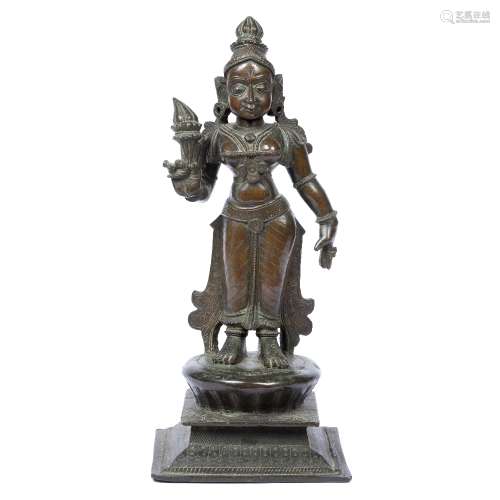 Bronze model of Shiva Indian, 19th century cast standing upright, holding a torch in one hand, on