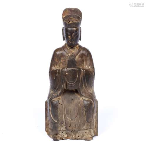Carved wood Daoist Deity Chinese, late Ming the seated figure holding sacred tablet, cavity in the
