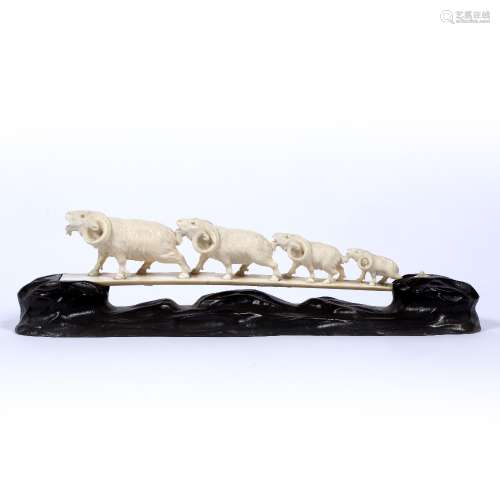 Ivory carving of a bridge Japanese, late Meiji depicting a line of four long horned goats, signed on