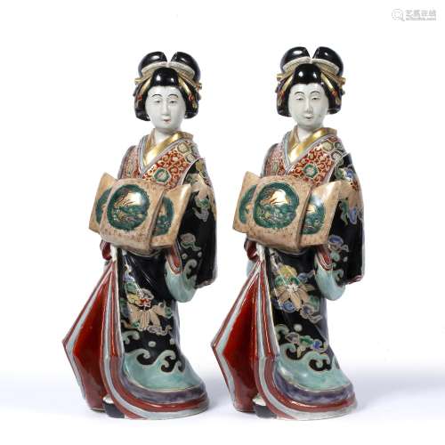 Pair of Satsuma model geisha Japanese, circa 1900 each wearing kimono with a large bow 39.5cm high