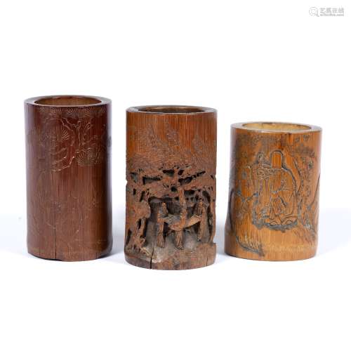 Three bamboo brush pots Chinese each carved with outdoor scenes including a Lohan with a bird the