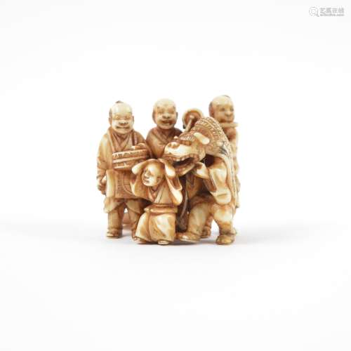 Ivory okimono Japanese of five street entertainers performing the lion dance, signed 3.5cm x 3.3cm