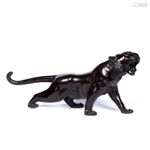 Bronze sculpture of a prowling tiger Japanese, late Meiji poised and snarling prior to attacking,