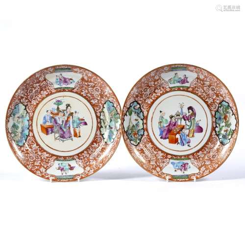 Pair of coral ground shallow dishes Chinese, early 19th Century the central circular panel painted