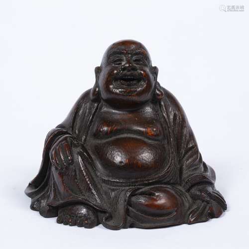 Bamboo figure of Buddha Chinese in a seated position, with loosely draped robes revealing a bare