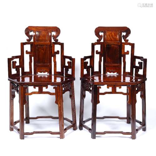 Pair of huanghuali throne chairs Chinese each with a carved back and solid seat 95cm high