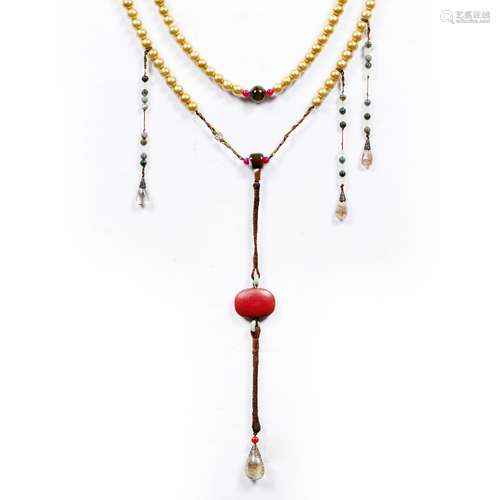 Buddhist necklace Tibetan, 20th Century made predominately of gilt beads with agate and jade and