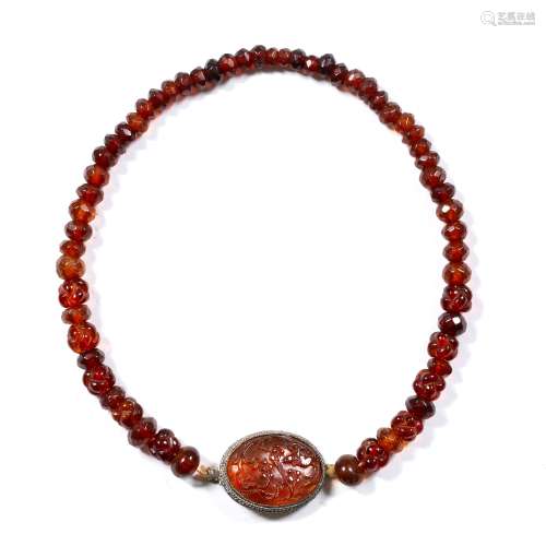 Carved amber bead necklace Chinese with oval carved pendant, with white metal mount, stamped China