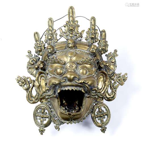 Brass mask of Bhairava Tibetan, circa 1890-1900 the figure with mouth open and extended tongue