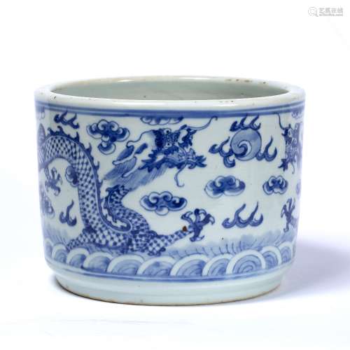 Blue and white bitong Chinese depicting two four clawed dragons in the sky above a swirling ocean