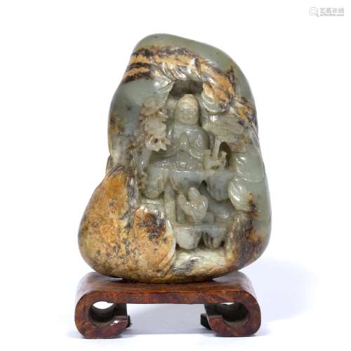 Carved jade boulder Chinese, 20th Century depicting a mountainous scene with a seated Buddha