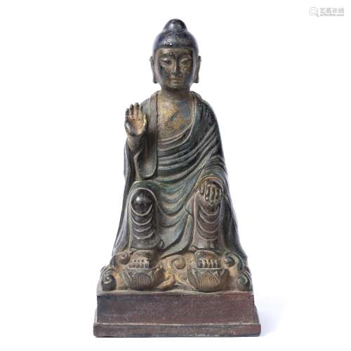 Bronze figure of Buddha Chinese, 17th/18th Century in traditional robes with one raised hand,