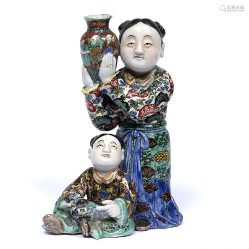 Polychrome model of two boys Chinese, 19th Century one holding a vase the other a mask 27cm