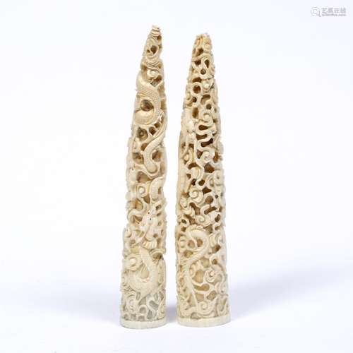 Two Canton carved ivory small tusks Chinese, late 19th Century each carved with entwined dragons