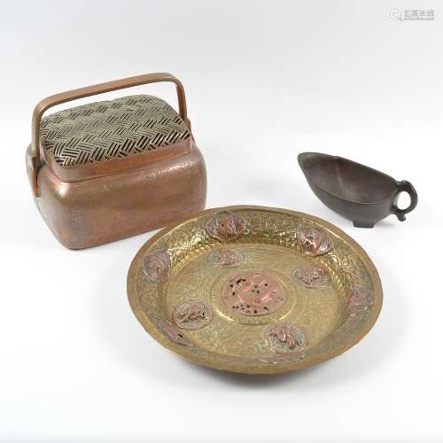 Brass and copper small charger Tibetan, 19th Century with roundels around the central dragon,