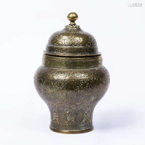 Engraved brass baluster jar with dome top Qajar, 19th Century with pierced and engraved panels and