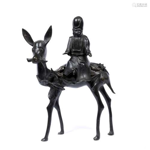 Bronze figure of a Lohan on a deer Chinese, 19th Century possibly Pindola the Bharadvaja, the deer