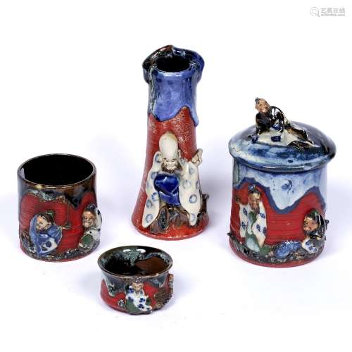 Four stoneware pieces Japanese, circa 1900 with applique decoration, to include a vase modelled in
