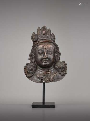 A COPPER REPOUSSE MASK OF BHAIRAVA