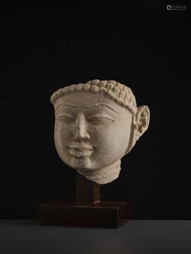 A SANDSTONE HEAD OF A TIRTHANKARA