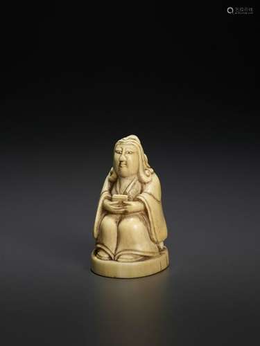 AN IVORY FIGURE OF A SCHOLAR, KANGXI